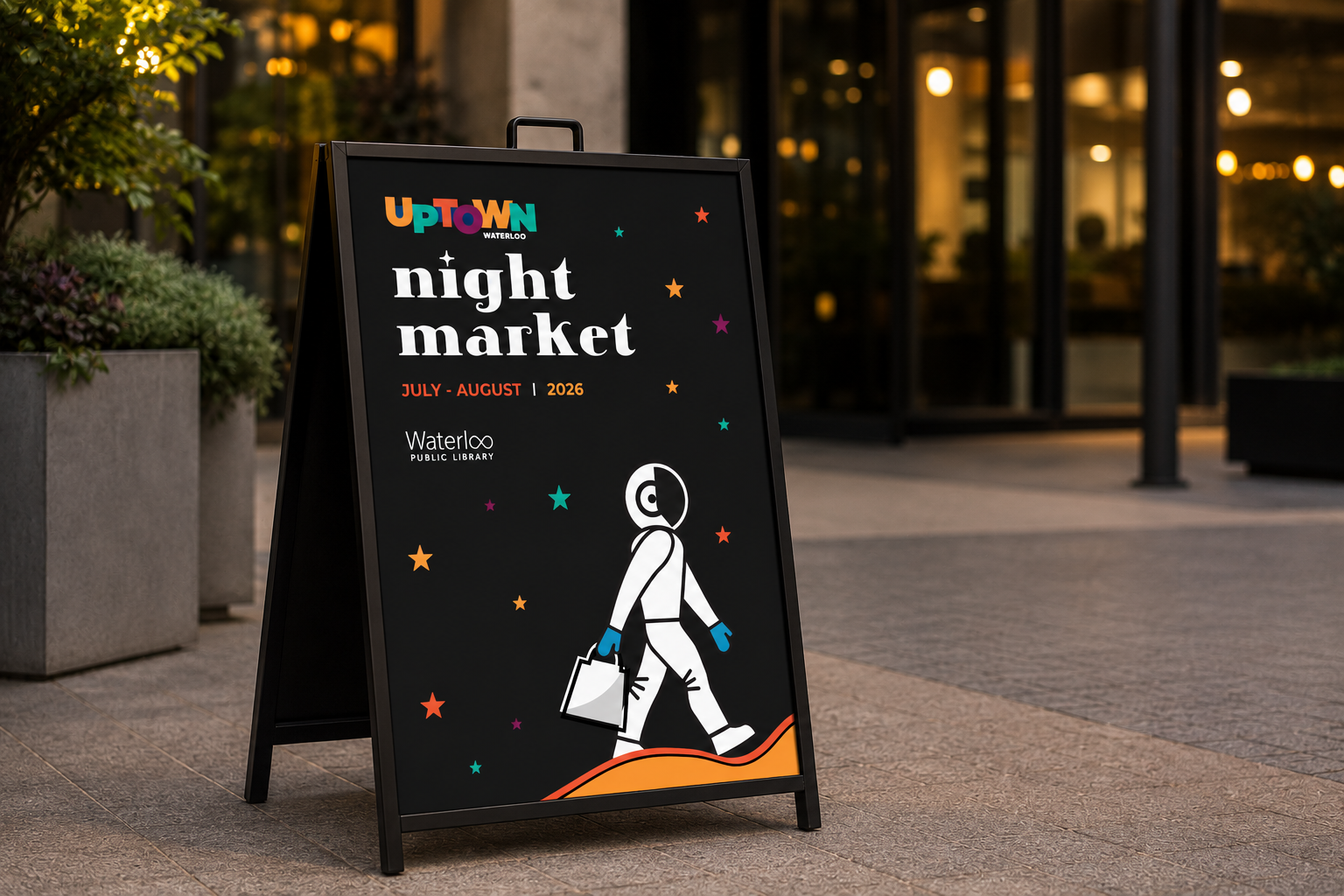 Uptown Waterloo Night Market A-frame sign outside Waterloo Public Library