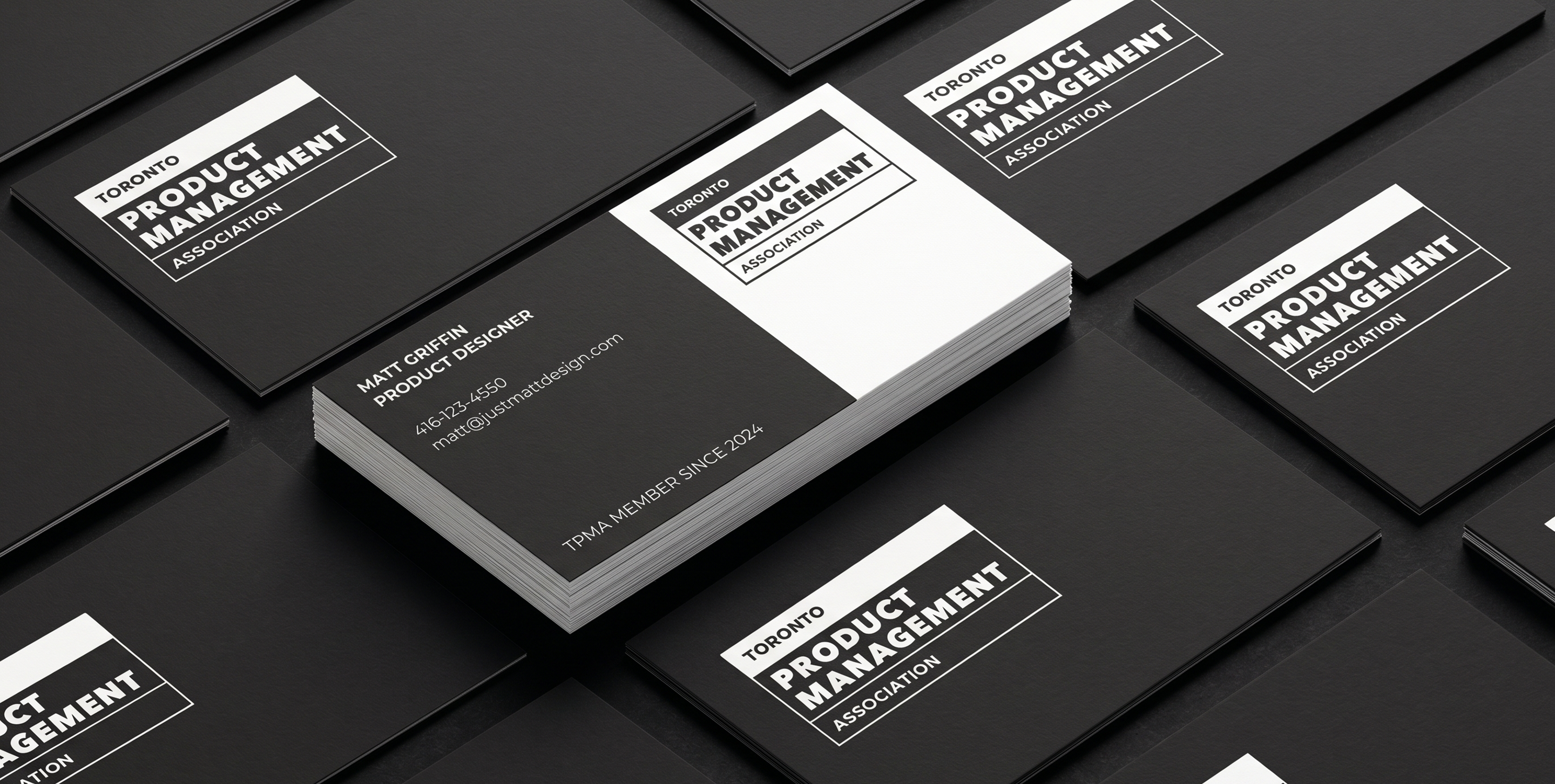 TPMA black and white business card mockups arranged on a dark surface